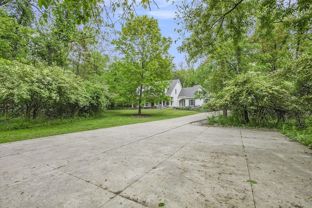 3113 Miller Rd, Ann Arbor, MI 48103 - view of property hidden behind natural elements with a front yard