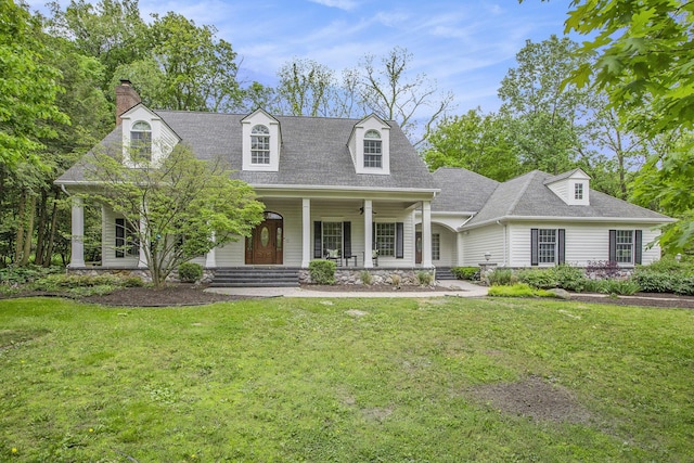 3113 Miller Rd, Ann Arbor, MI 48103 - cape cod house with a front yard, covered porch, a chimney, and roof with shingles