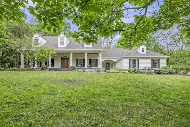 3113 Miller Rd, Ann Arbor, MI 48103 - cape cod home featuring a front yard, a porch, a chimney, and roof with shingles