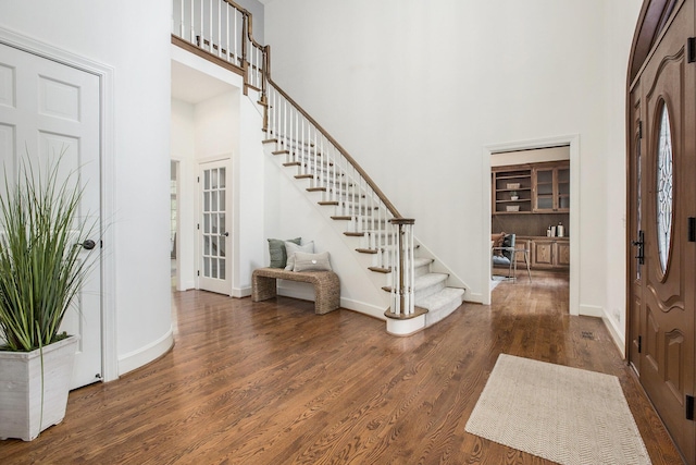 3113 Miller Rd, Ann Arbor, MI 48103 - foyer with a towering ceiling, stairway, wood finished floors, and baseboards
