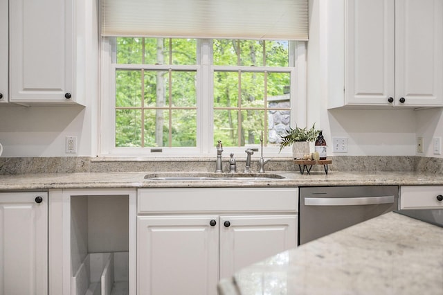 3113 Miller Rd, Ann Arbor, MI 48103 - kitchen with dishwasher, a sink, plenty of natural light, and white cabinetry