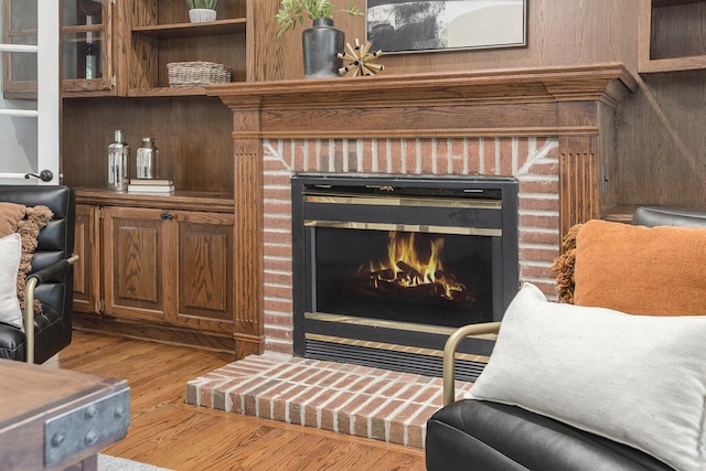 3113 Miller Rd, Ann Arbor, MI 48103 - living area featuring a fireplace and wood finished floors