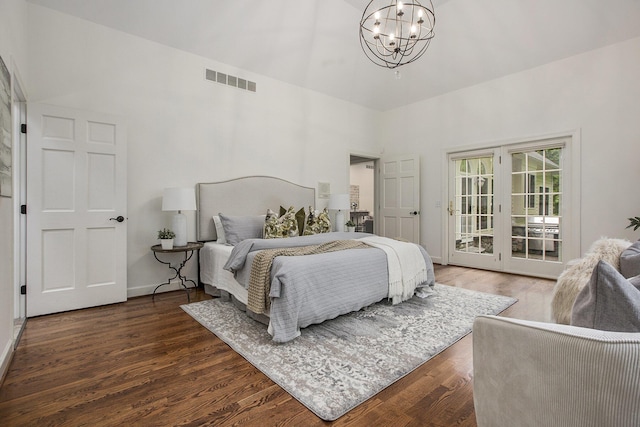 3113 Miller Rd, Ann Arbor, MI 48103 - bedroom featuring a chandelier, access to outside, a high ceiling, and wood finished floors