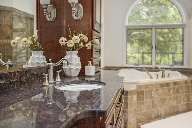 3113 Miller Rd, Ann Arbor, MI 48103 - full bath featuring vanity and tiled tub