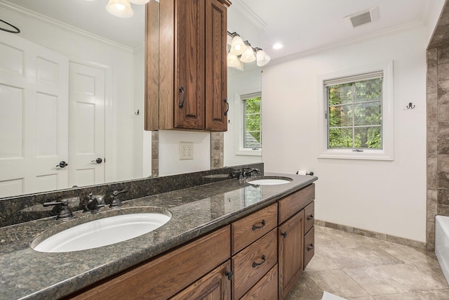 3113 Miller Rd, Ann Arbor, MI 48103 - bathroom with double vanity, baseboards, ornamental molding, and a bath