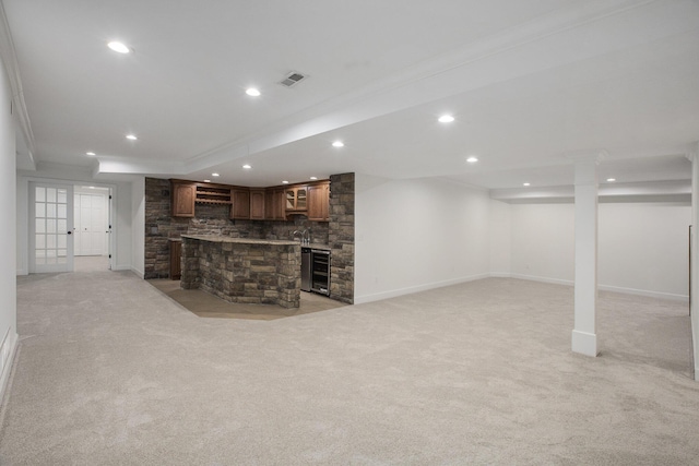 3113 Miller Rd, Ann Arbor, MI 48103 - unfurnished living room with light carpet, beverage cooler, recessed lighting, baseboards, and a stone fireplace