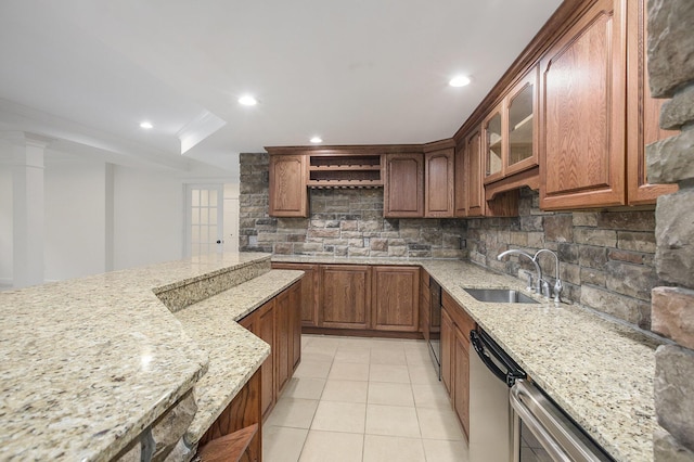 3113 Miller Rd, Ann Arbor, MI 48103 - kitchen featuring a sink, tasteful backsplash, light stone counters, light tile patterned flooring, and recessed lighting