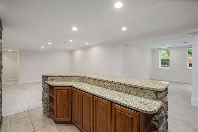 3113 Miller Rd, Ann Arbor, MI 48103 - kitchen with light carpet, open floor plan, open shelves, recessed lighting, and light stone counters