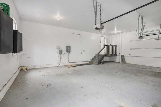 3113 Miller Rd, Ann Arbor, MI 48103 - garage featuring a garage door opener and electric panel