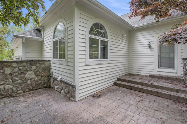 3113 Miller Rd, Ann Arbor, MI 48103 - view of side of home with a patio and a shingled roof