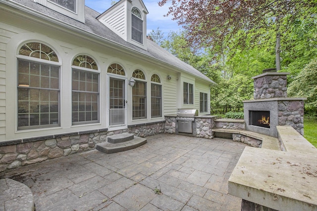 3113 Miller Rd, Ann Arbor, MI 48103 - view of patio / terrace featuring an outdoor stone fireplace