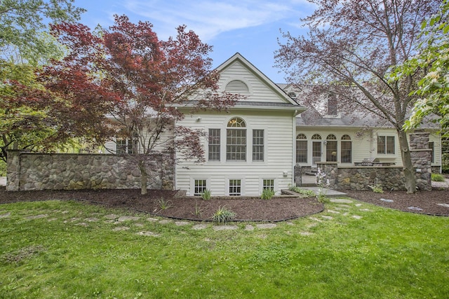 3113 Miller Rd, Ann Arbor, MI 48103 - back of house featuring a lawn and stone siding