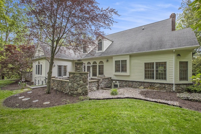 3113 Miller Rd, Ann Arbor, MI 48103 - back of house featuring stone siding and a lawn