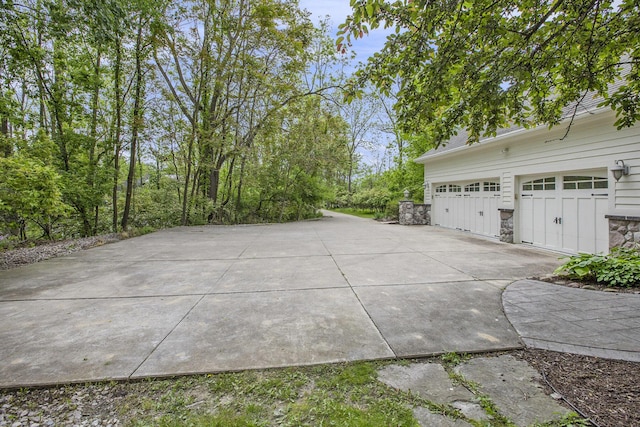 3113 Miller Rd, Ann Arbor, MI 48103 - exterior space featuring concrete driveway and a garage