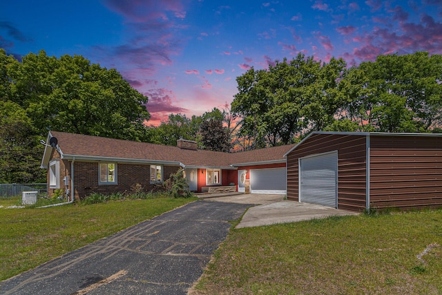 2639 Dutch Acres, Allegan, MI 49010 - ranch-style home with asphalt driveway, a garage, central air condition unit, a chimney, and brick siding