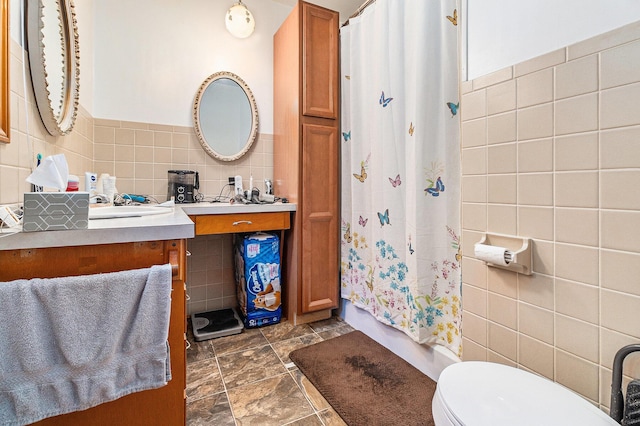 2639 Dutch Acres, Allegan, MI 49010 - bathroom with tile walls, toilet, vanity, and shower / tub combo