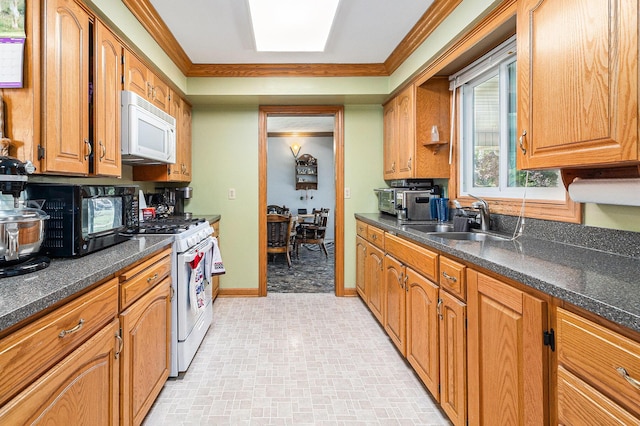 2639 Dutch Acres, Allegan, MI 49010 - kitchen featuring white appliances, a sink, dark countertops, baseboards, and ornamental molding