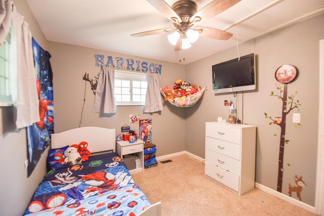 493 Swan Ln, Coldwater, MI 49036 - bedroom with light colored carpet, a ceiling fan, and baseboards