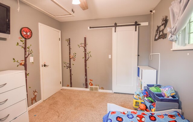 493 Swan Ln, Coldwater, MI 49036 - playroom with carpet floors, a barn door, a ceiling fan, and attic access