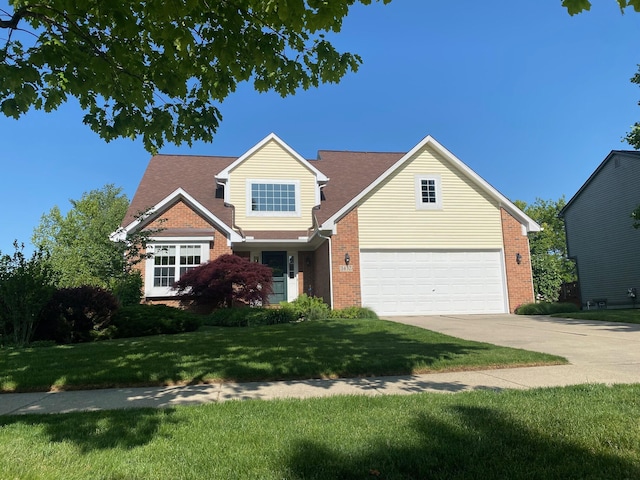1432 Auston Ln, Chelsea, MI 48118 - traditional-style house featuring brick siding, driveway, a front yard, and a garage