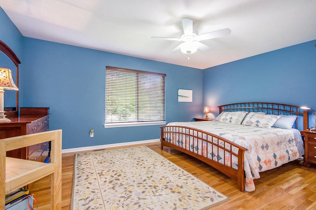 1432 Auston Ln, Chelsea, MI 48118 - bedroom with wood finished floors, baseboards, and ceiling fan
