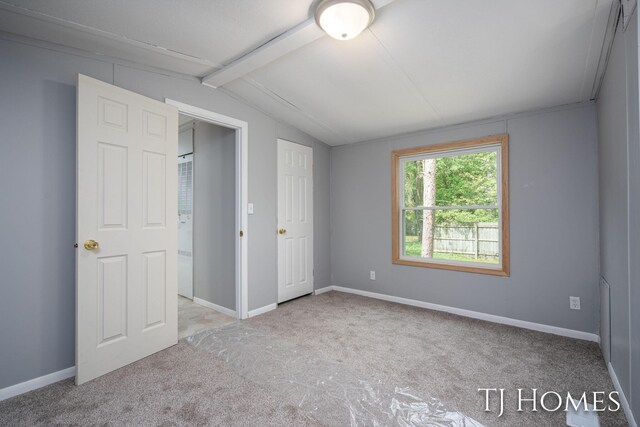 3010 E 96th St, Newaygo, MI 49337 - unfurnished bedroom with carpet flooring and baseboards