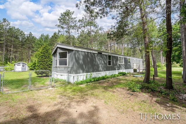 3010 E 96th St, Newaygo, MI 49337 - view of front of house featuring a gate