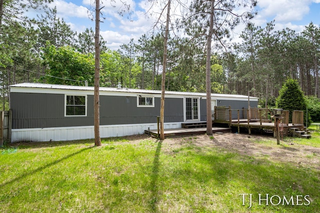 3010 E 96th St, Newaygo, MI 49337 - back of house with a deck and a yard