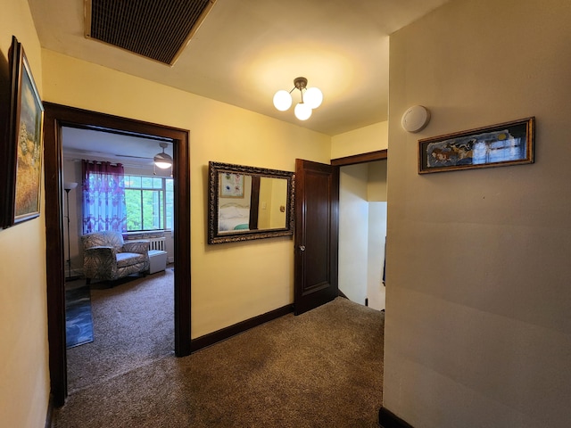 4489 Kensington Ave, Detroit, MI 48224 - corridor with dark colored carpet and baseboards