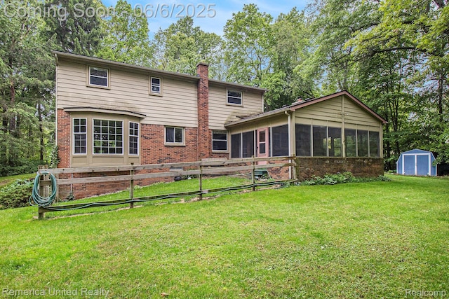 11187 Shadywood Dr, Brighton, MI 48114 - rear view of property with a sunroom, a chimney, and brick siding