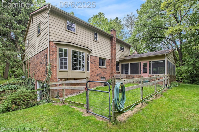 11187 Shadywood Dr, Brighton, MI 48114 - back of house with a sunroom, brick siding, and a chimney