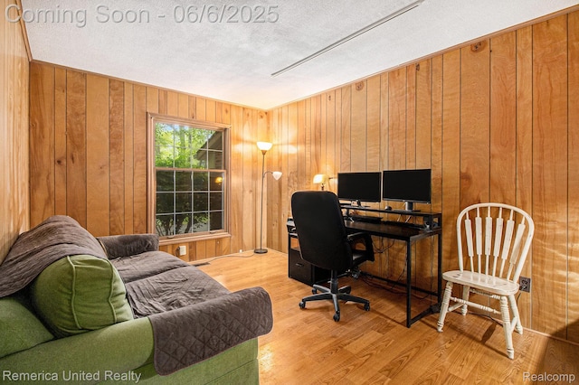 11187 Shadywood Dr, Brighton, MI 48114 - office area with light wood-style floors and wooden walls