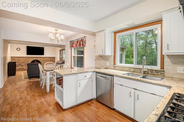 11187 Shadywood Dr, Brighton, MI 48114 - kitchen with appliances with stainless steel finishes, a sink, open shelves, a peninsula, and open floor plan