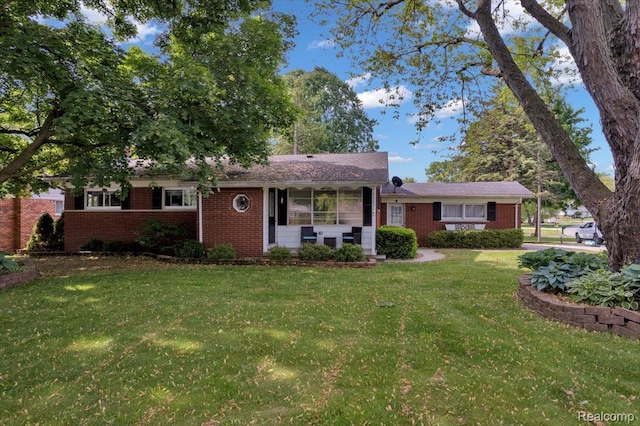 12016 Barbara Ann Dr, Washington, MI 48095 - view of front of home with brick siding and a front lawn