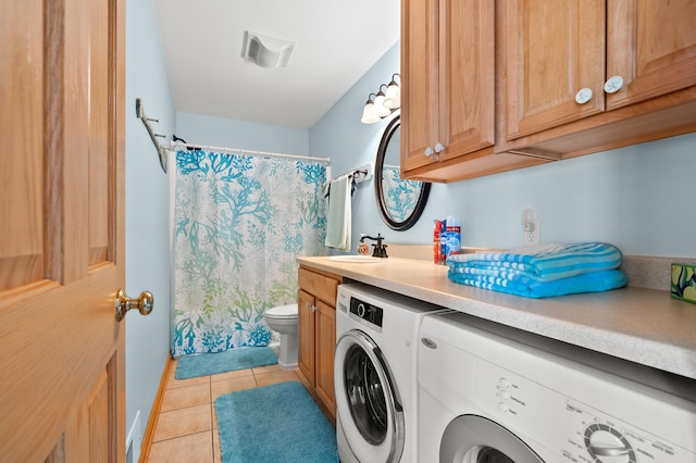 8843 Silver Lake Rd, Grand Junction, MI 49056 - laundry area with independent washer and dryer, a sink, and light tile patterned floors