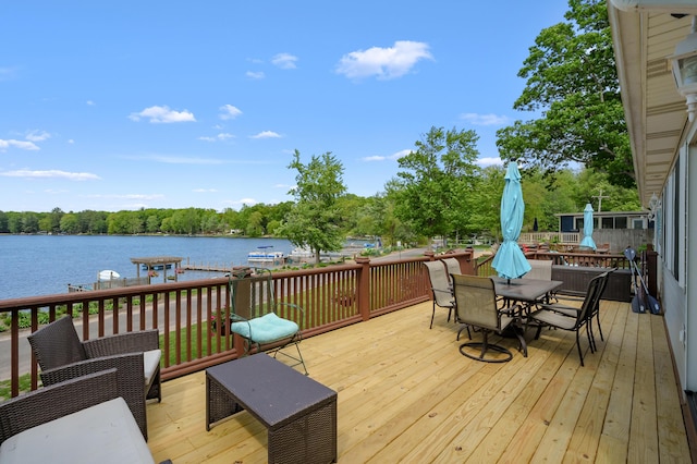 8843 Silver Lake Rd, Grand Junction, MI 49056 - wooden terrace featuring a water view and outdoor dining space