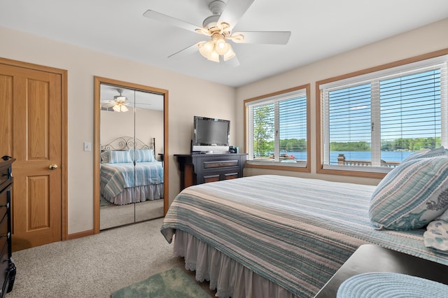 8843 Silver Lake Rd, Grand Junction, MI 49056 - carpeted bedroom with a closet, a ceiling fan, and baseboards