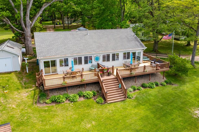 8843 Silver Lake Rd, Grand Junction, MI 49056 - rear view of house featuring a deck, stairway, a lawn, and roof with shingles