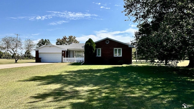 1220 N Raisinville Rd, Monroe, MI 48162 - ranch-style house featuring concrete driveway and a garage