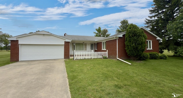 1220 N Raisinville Rd, Monroe, MI 48162 - ranch-style home featuring driveway, a garage, and brick siding