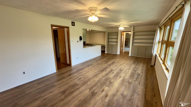 1220 N Raisinville Rd, Monroe, MI 48162 - unfurnished living room featuring a ceiling fan and dark wood finished floors