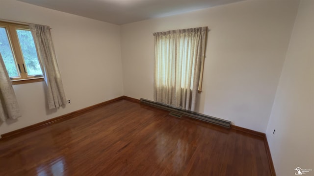 1220 N Raisinville Rd, Monroe, MI 48162 - spare room featuring wood finished floors and baseboards