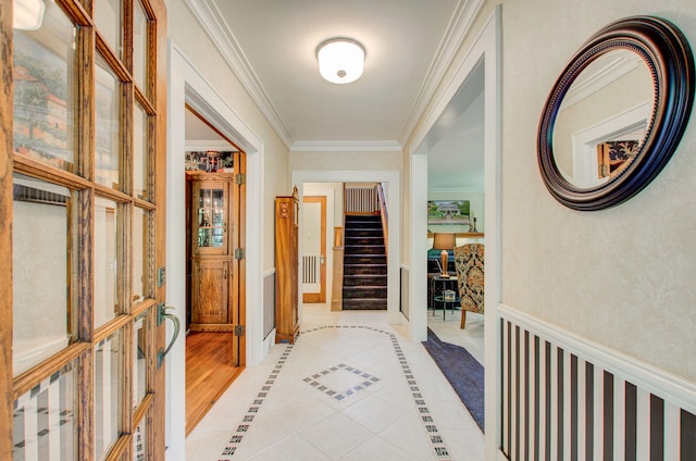 902 Oakridge Dr, Jackson, MI 49203 - hallway featuring stairway, ornamental molding, light tile patterned floors, and baseboards
