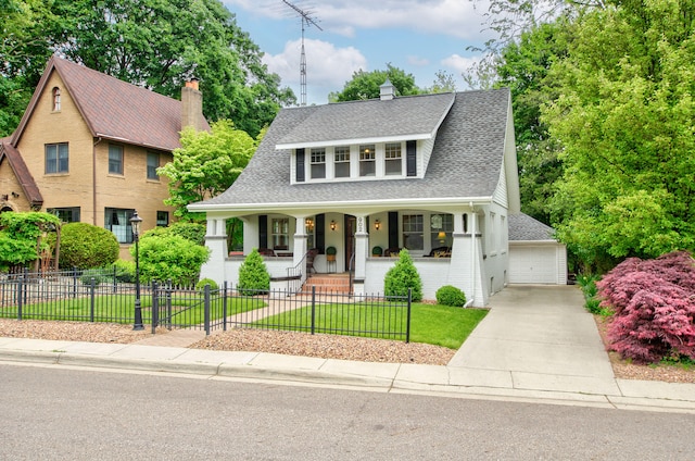 902 Oakridge Dr, Jackson, MI 49203 - view of front of home with a porch, roof with shingles, a garage, and brick siding