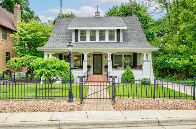 902 Oakridge Dr, Jackson, MI 49203 - view of front of property with a porch, a gate, roof with shingles, and brick siding