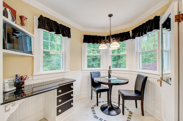 902 Oakridge Dr, Jackson, MI 49203 - dining space with ornamental molding, light tile patterned floors, a wainscoted wall, and a chandelier