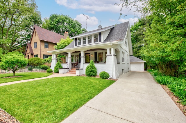 902 Oakridge Dr, Jackson, MI 49203 - bungalow-style home featuring covered porch, roof with shingles, brick siding, a detached garage, and a chimney