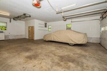 221 S Taylor St, New Buffalo, MI 49117 - garage with a garage door opener
