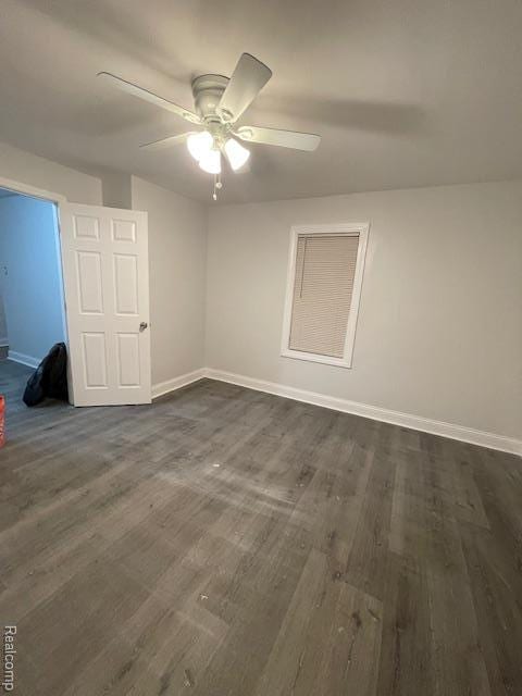19961 Forrer St, Detroit, MI 48235 - spare room featuring dark wood-style floors, baseboards, and ceiling fan