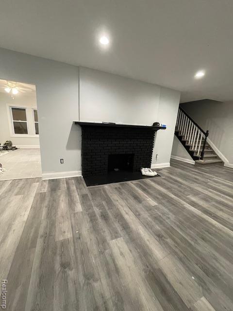 19961 Forrer St, Detroit, MI 48235 - unfurnished living room with baseboards, wood finished floors, stairway, and recessed lighting